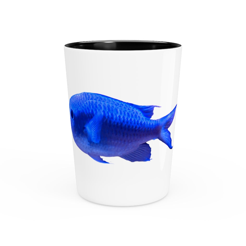 A stylish Blue Fish Shot Glass made of white ceramic with a customizable design, featuring a black interior.