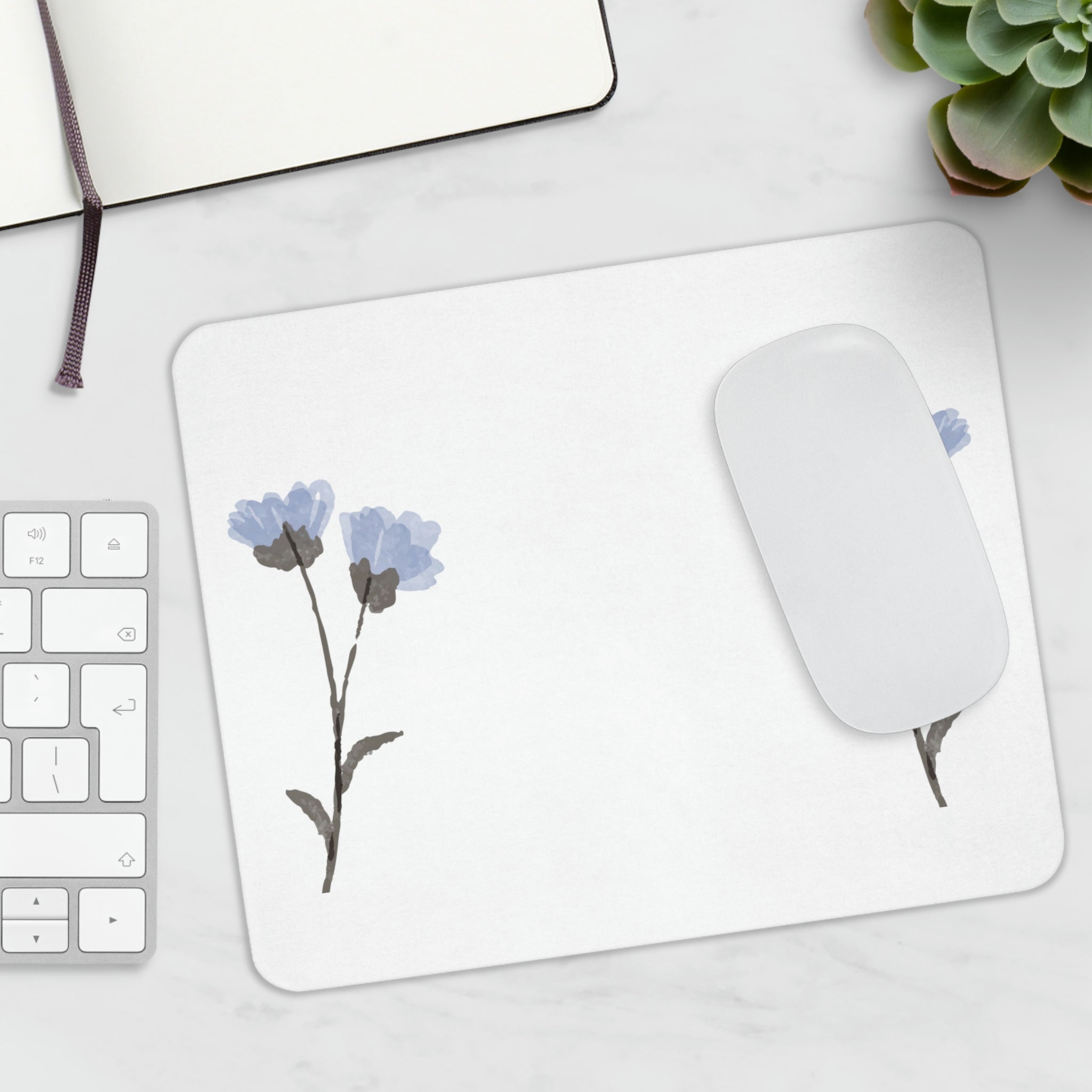 A vibrant blue flowers mouse pad with a soft surface and non-slip rubber base, perfect for enhancing any workspace.