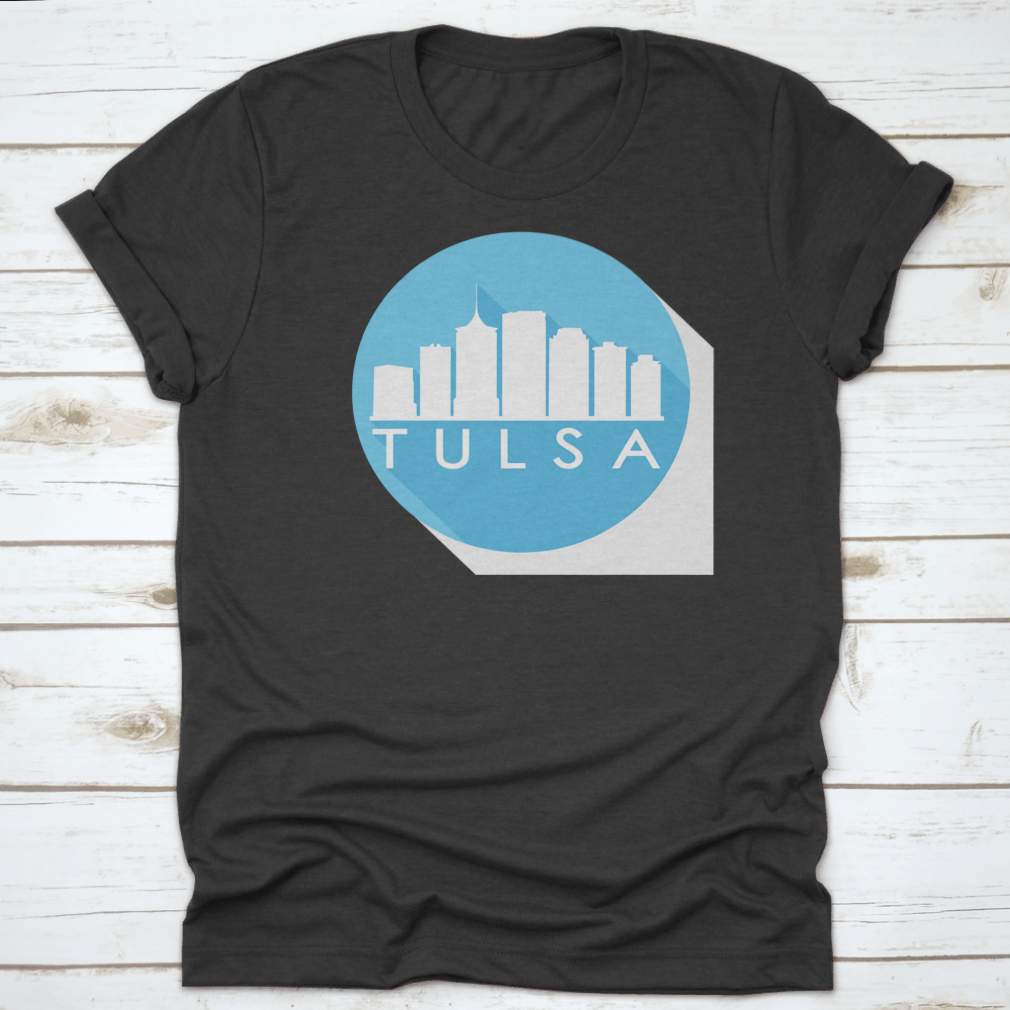 A round flat vector art illustration of the Tulsa skyline in blue, showcasing iconic buildings and structures.