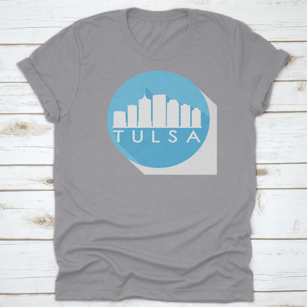 A round flat vector art illustration of the Tulsa skyline in blue, showcasing iconic buildings and structures.