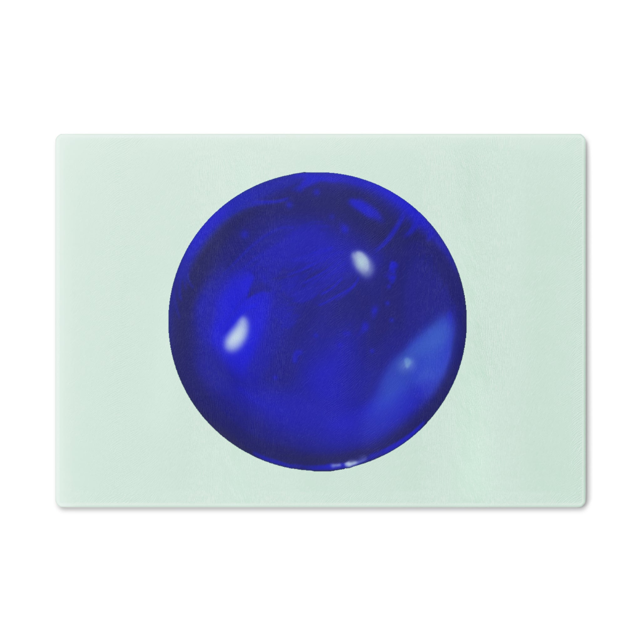 Blue Orb Cutting Board made of tempered glass with rubber dots for stability, showcasing a unique design perfect for kitchen use.