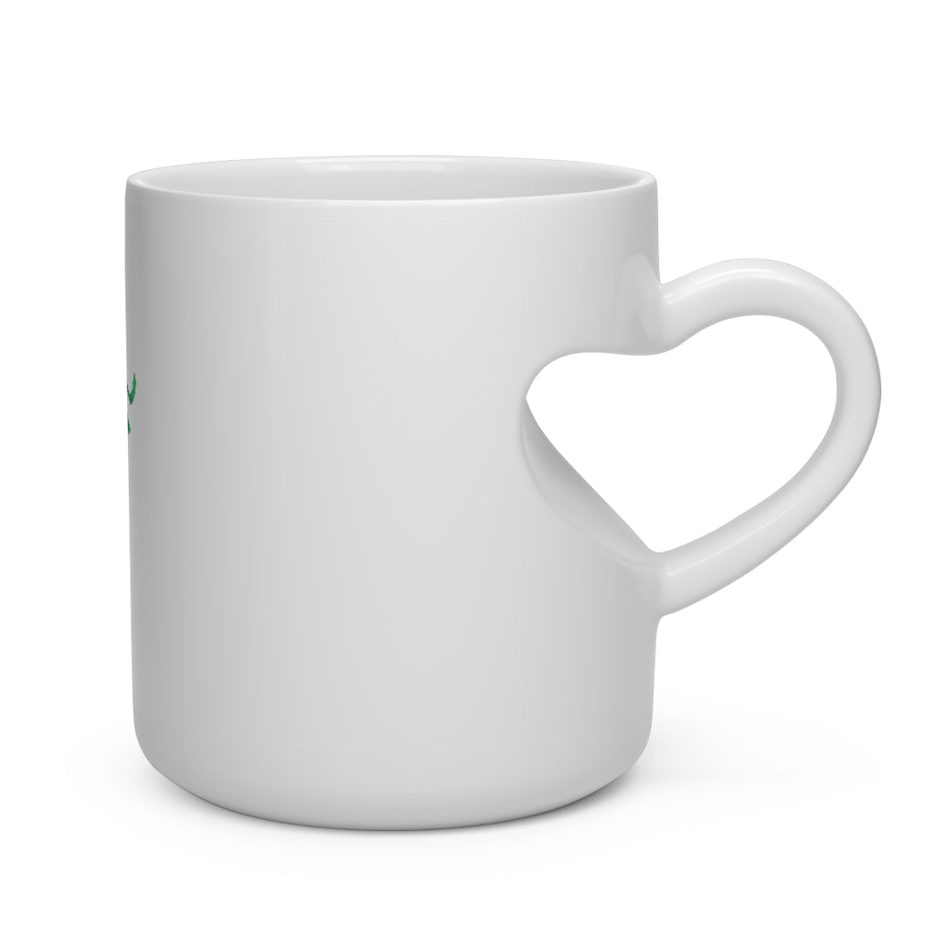 A white ceramic heart-shaped mug with a heart-shaped handle, designed for hot beverages, showcasing its unique and charming design.