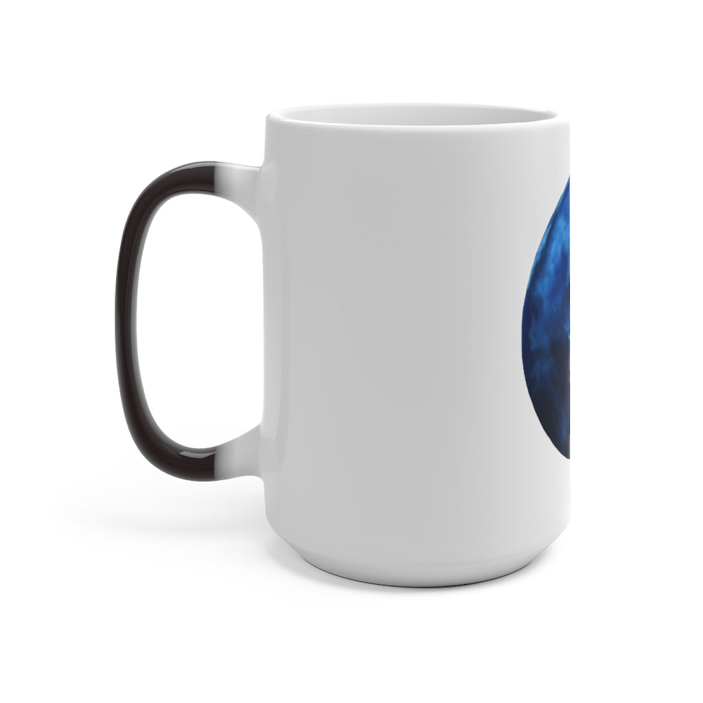 A blue ceramic mug that changes color when filled with hot liquid, showcasing its unique design and C-handle.