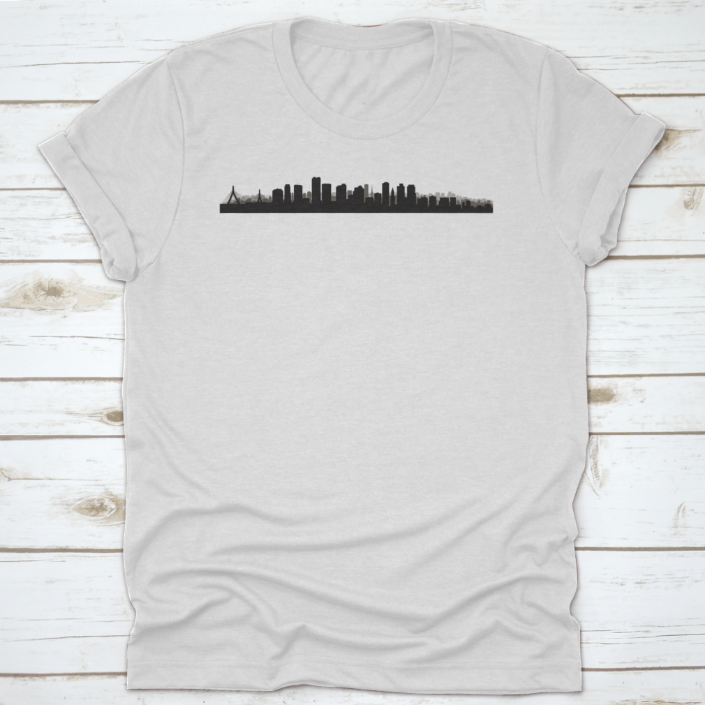 A panoramic view of the Boston skyline, showcasing iconic buildings and cityscape, printed on a comfortable t-shirt.