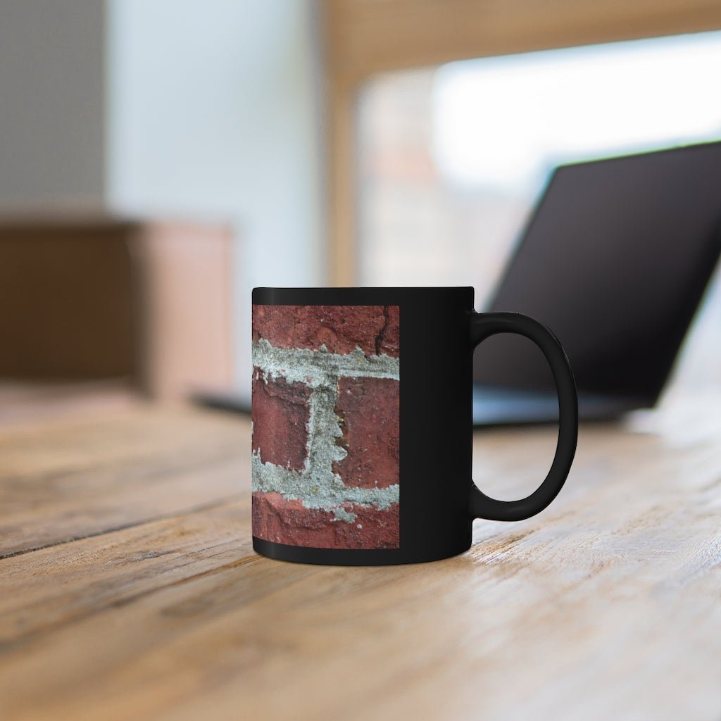 Bricks 11oz black ceramic mug with a sleek design, perfect for coffee, tea, or hot chocolate, showcasing customizable options.