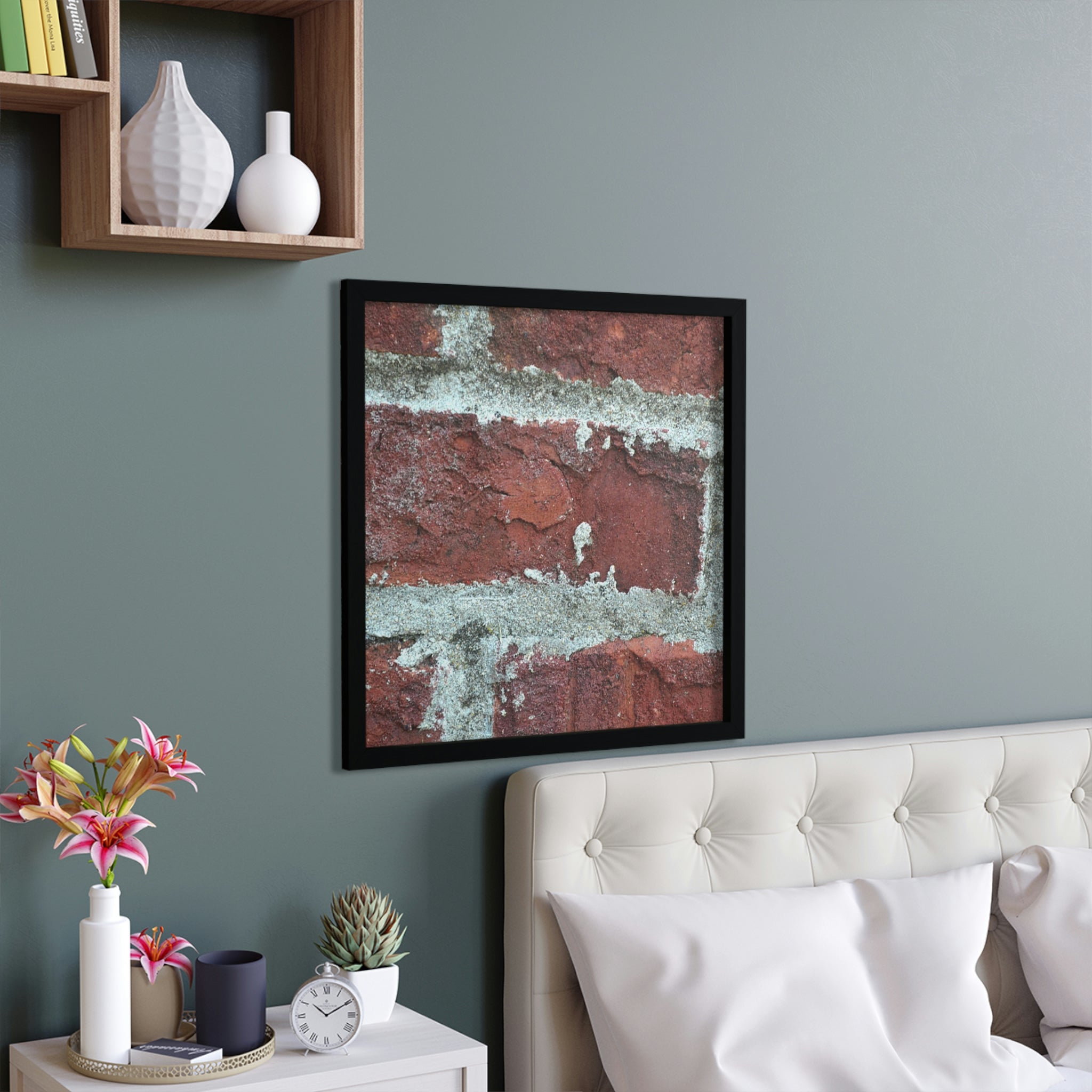 A beautifully framed poster featuring a brick design, showcasing a hand-crafted wooden frame and vibrant colors.