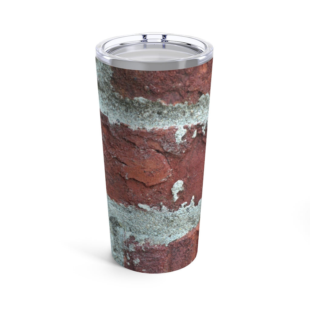 Bricks Tumbler 20oz in stainless steel with a see-thru plastic lid, showcasing its sleek design and rounded corners.