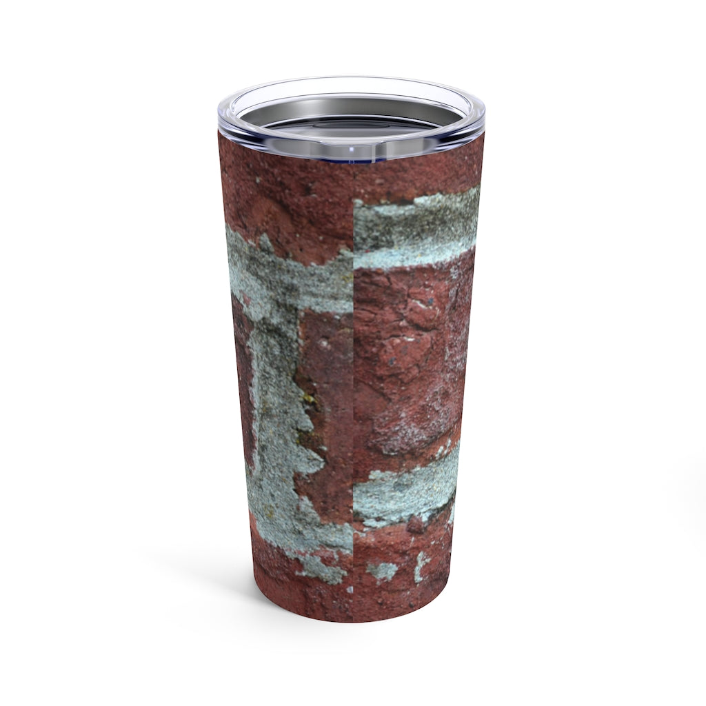 Bricks Tumbler 20oz in stainless steel with a see-thru plastic lid, showcasing its sleek design and rounded corners.