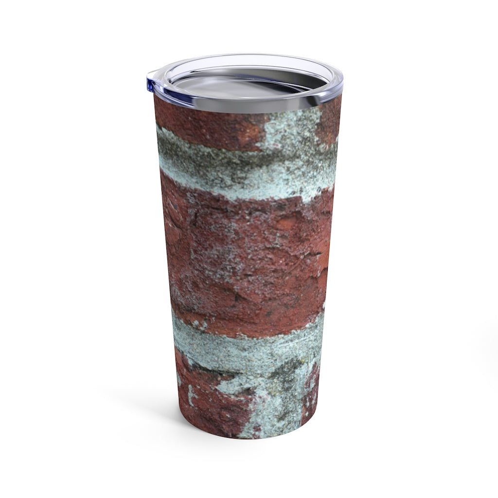 Bricks Tumbler 20oz in stainless steel with a see-thru plastic lid, showcasing its sleek design and rounded corners.