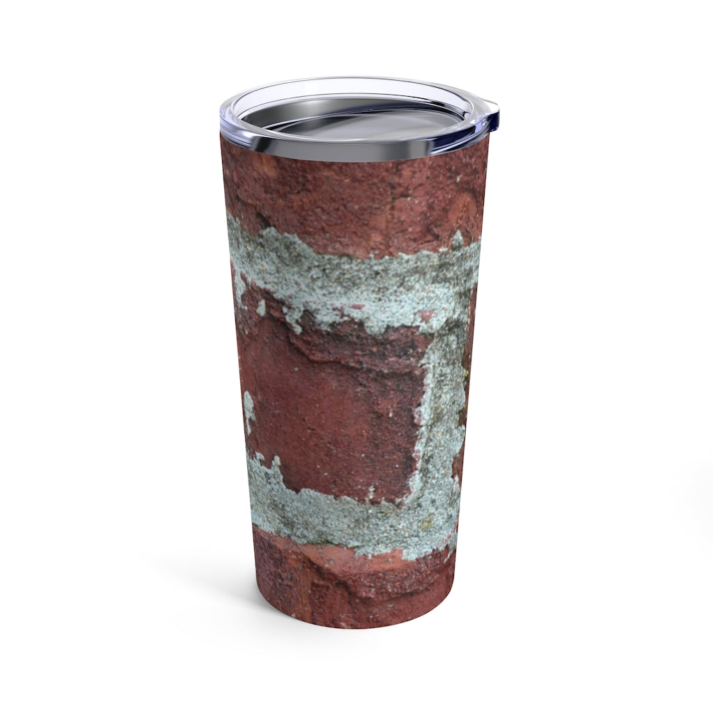 Bricks Tumbler 20oz in stainless steel with a see-thru plastic lid, showcasing its sleek design and rounded corners.