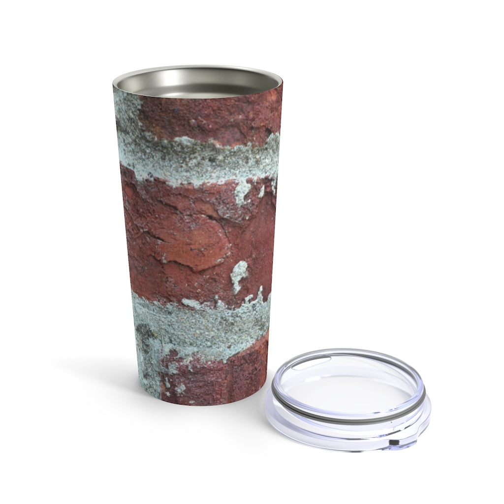 Bricks Tumbler 20oz in stainless steel with a see-thru plastic lid, showcasing its sleek design and rounded corners.