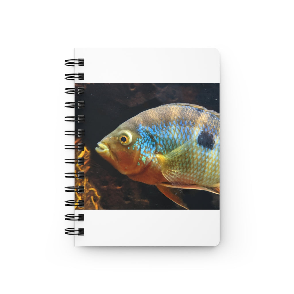 Brown and orange spiral bound journal featuring a vibrant fish design on the cover, with a glossy laminated finish and lined pages inside.