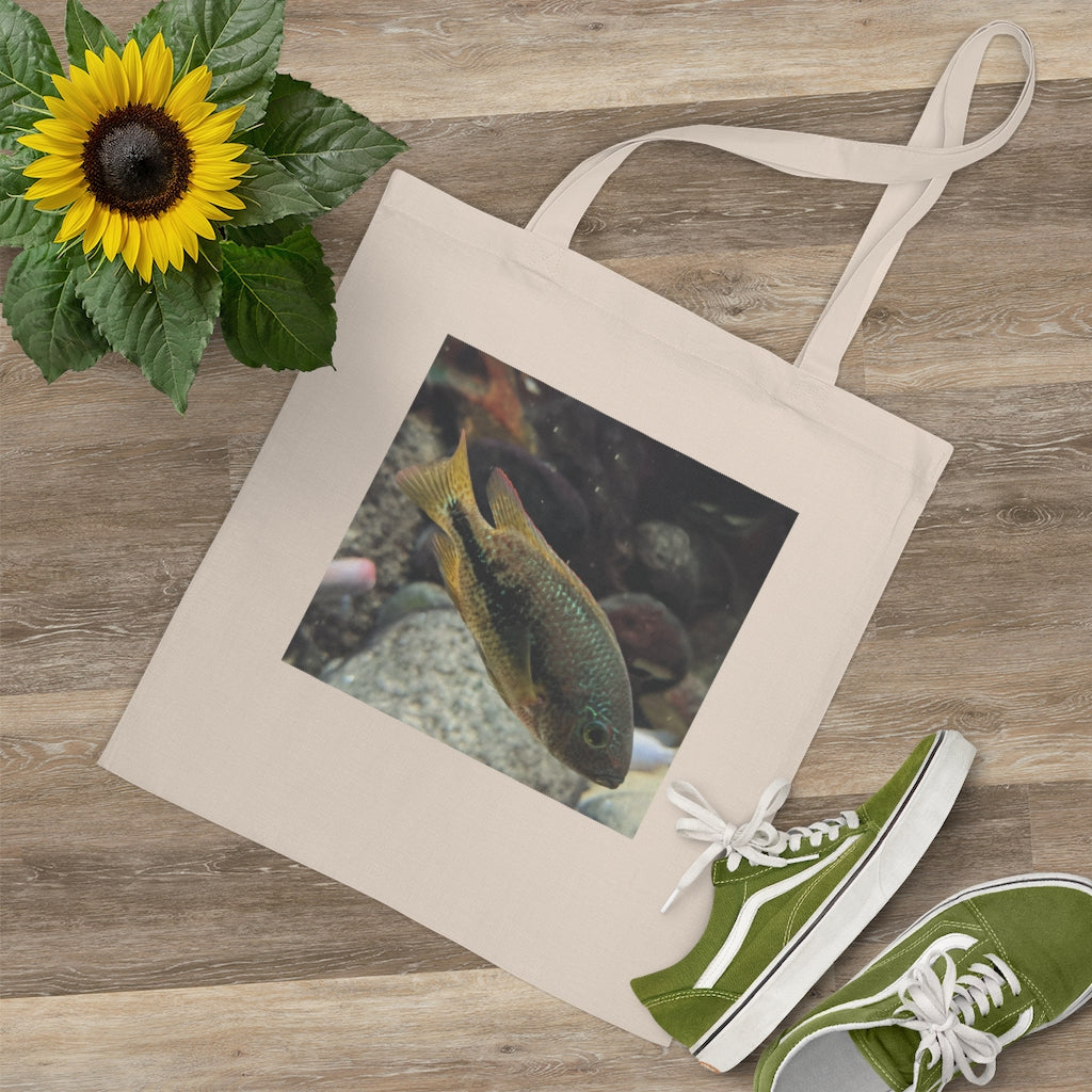 Brown and orange fish tote bag with long handles, made of 100% cotton fabric, featuring a vibrant fish design.