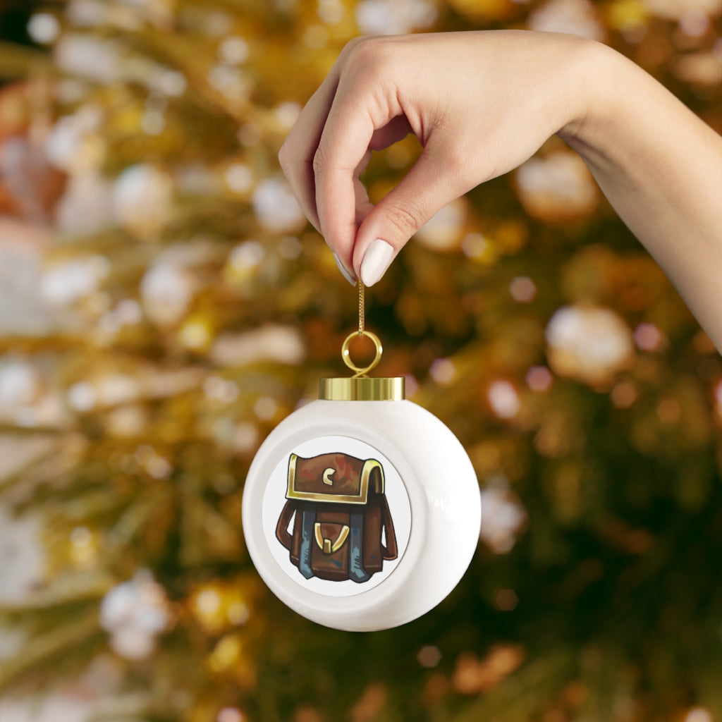 A beautiful 3-inch Brown Bag Christmas Ball Ornament with a glossy finish, featuring a gold ribbon for hanging and a vintage design.