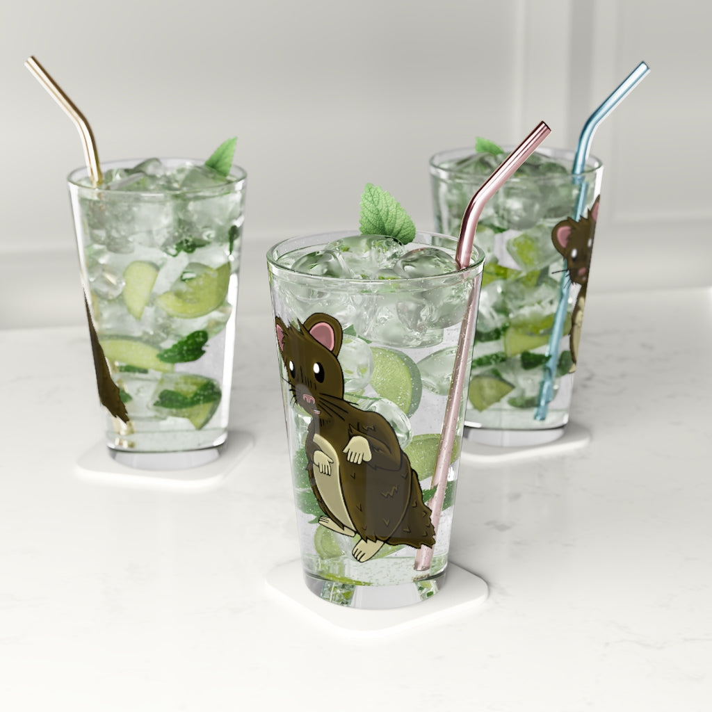 A clear 16oz pint glass featuring a brown hamster design, perfect for personalized beverages.