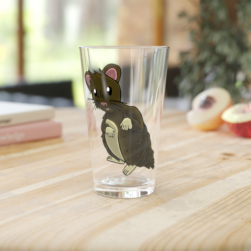 A clear 16oz pint glass featuring a brown hamster design, perfect for personalized beverages.