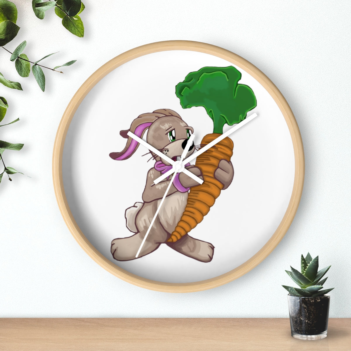 A whimsical wall clock featuring a bunny holding a carrot, set in a wooden frame with a clear plexiglass face.