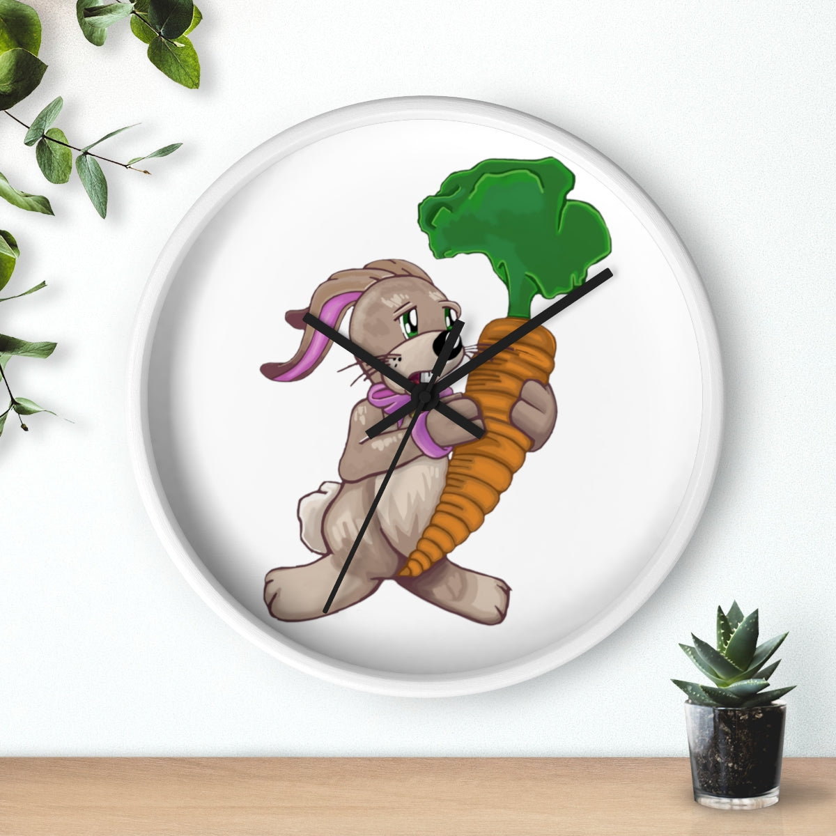 A whimsical wall clock featuring a bunny holding a carrot, set in a wooden frame with a clear plexiglass face.