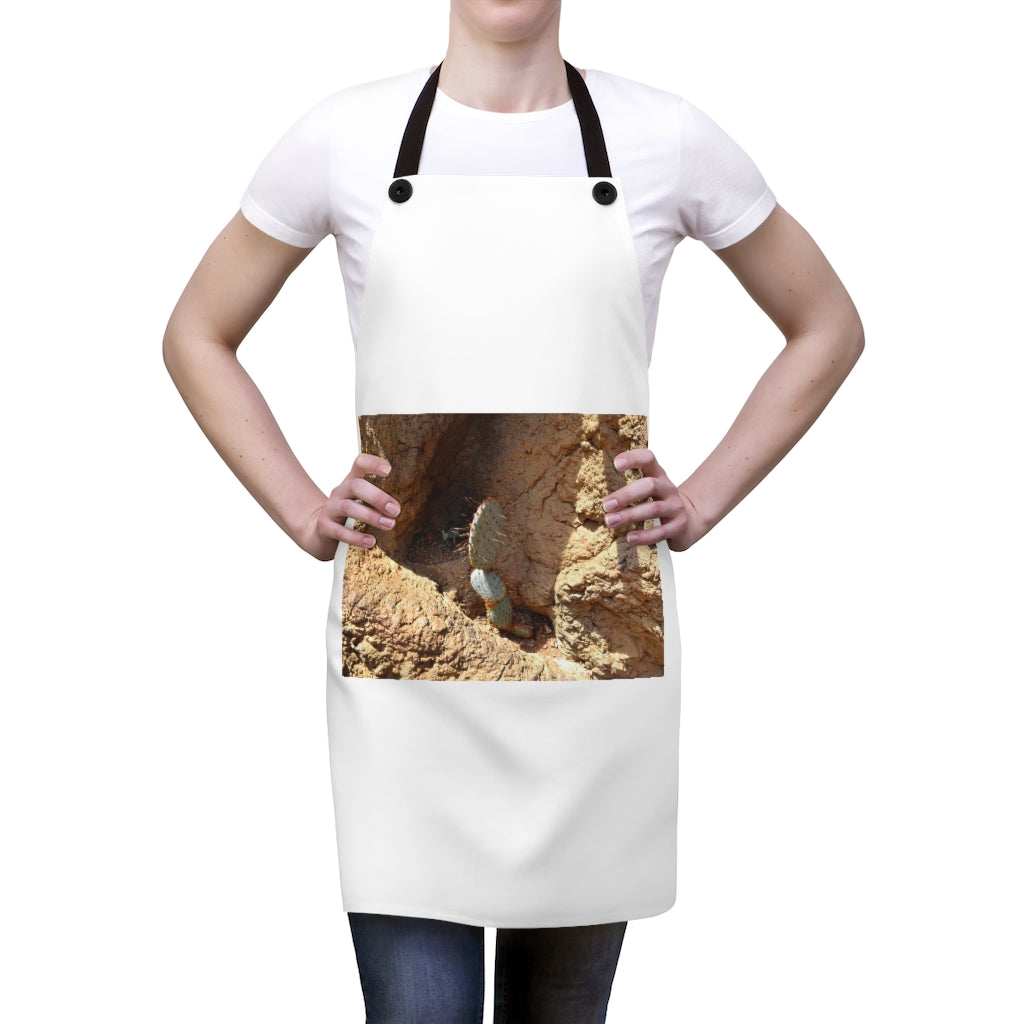 Stylish cactus-themed apron with black detachable straps, perfect for cooking.