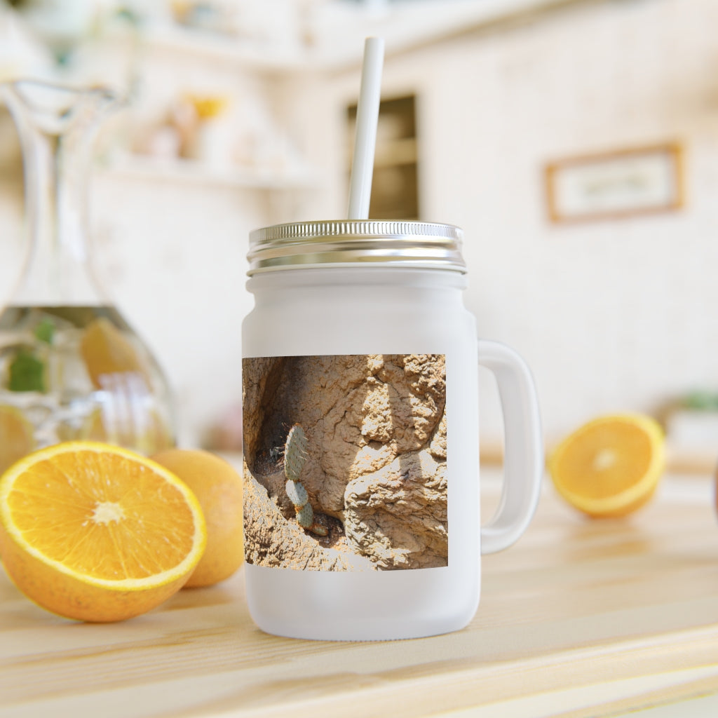 A stylish Cactus Mason Jar made of frosted glass, featuring a straw and lid, perfect for personalized drinks.