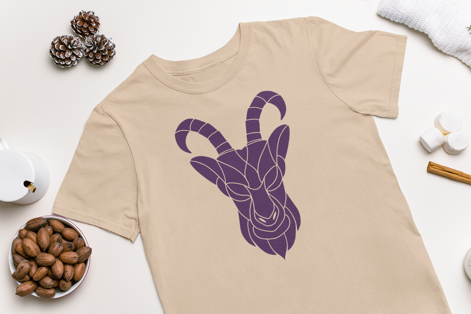 A stylish t-shirt featuring a Capricorn goat symbol in a creative cut-out design, perfect for zodiac enthusiasts.