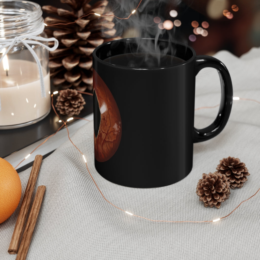 A stylish Cat Eyes 11oz black ceramic mug with a C-handle, perfect for coffee, tea, or hot chocolate.