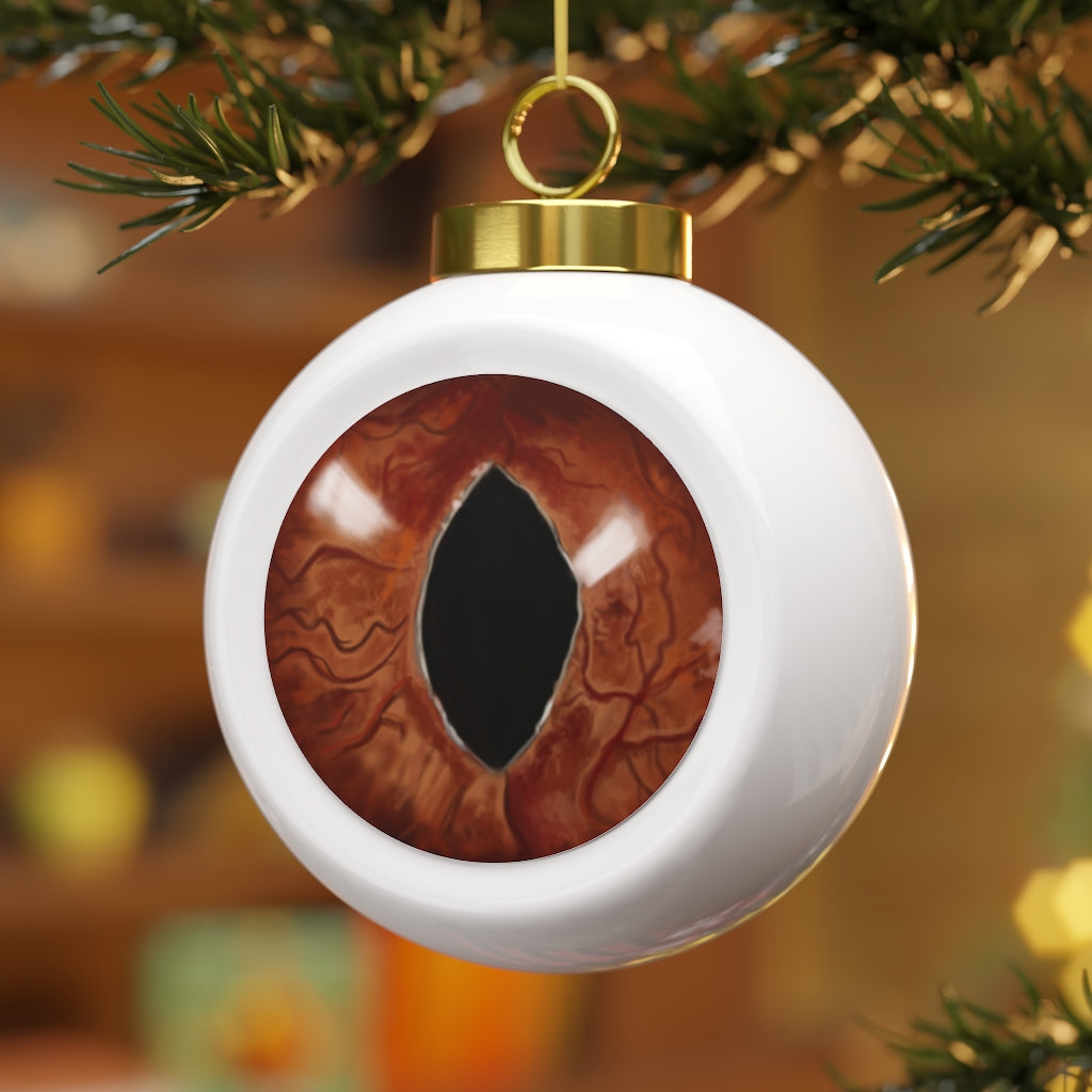 A beautifully crafted Cat Eyes Christmas Ball Ornament featuring a glossy finish and a gold ribbon for hanging, perfect for holiday decor.