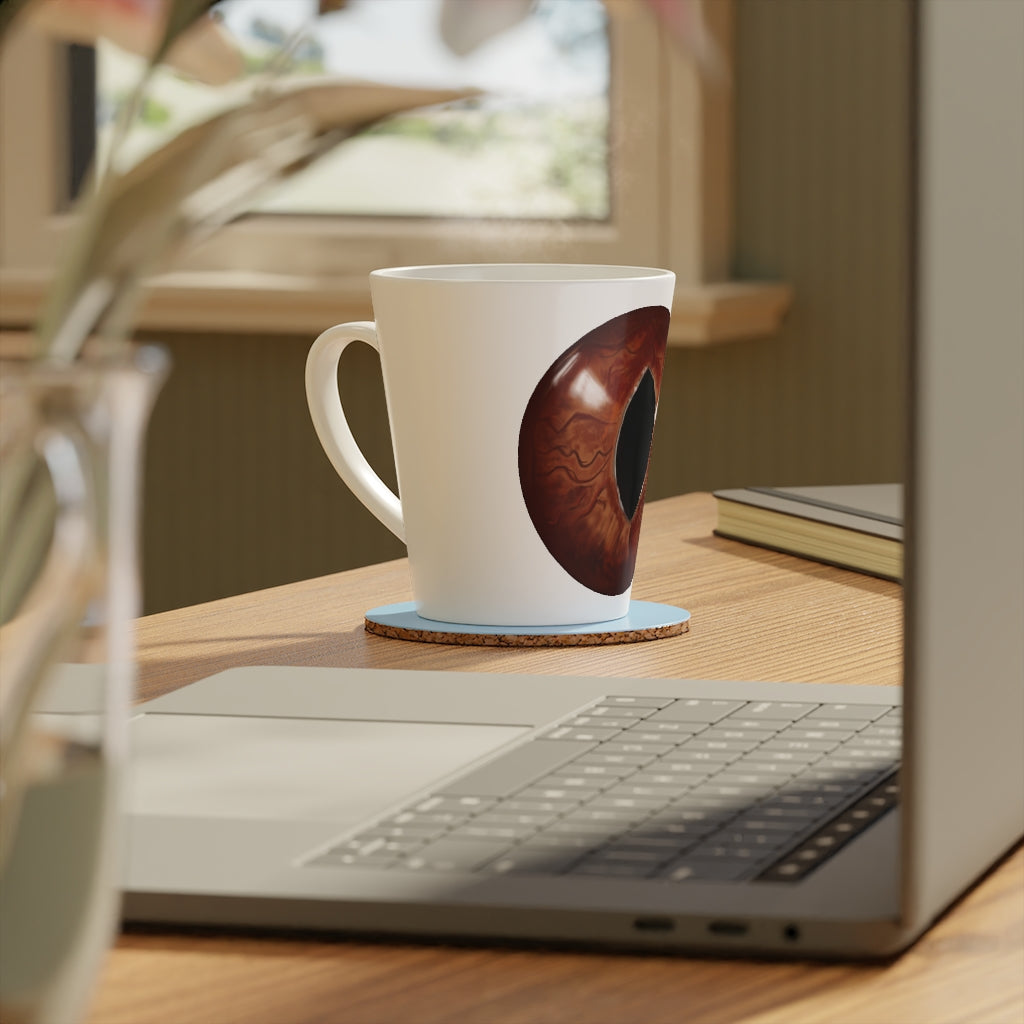 A stylish Cat Eyes Latte Mug featuring a playful cat eyes design, made of durable white ceramic with a comfortable C-shaped handle.