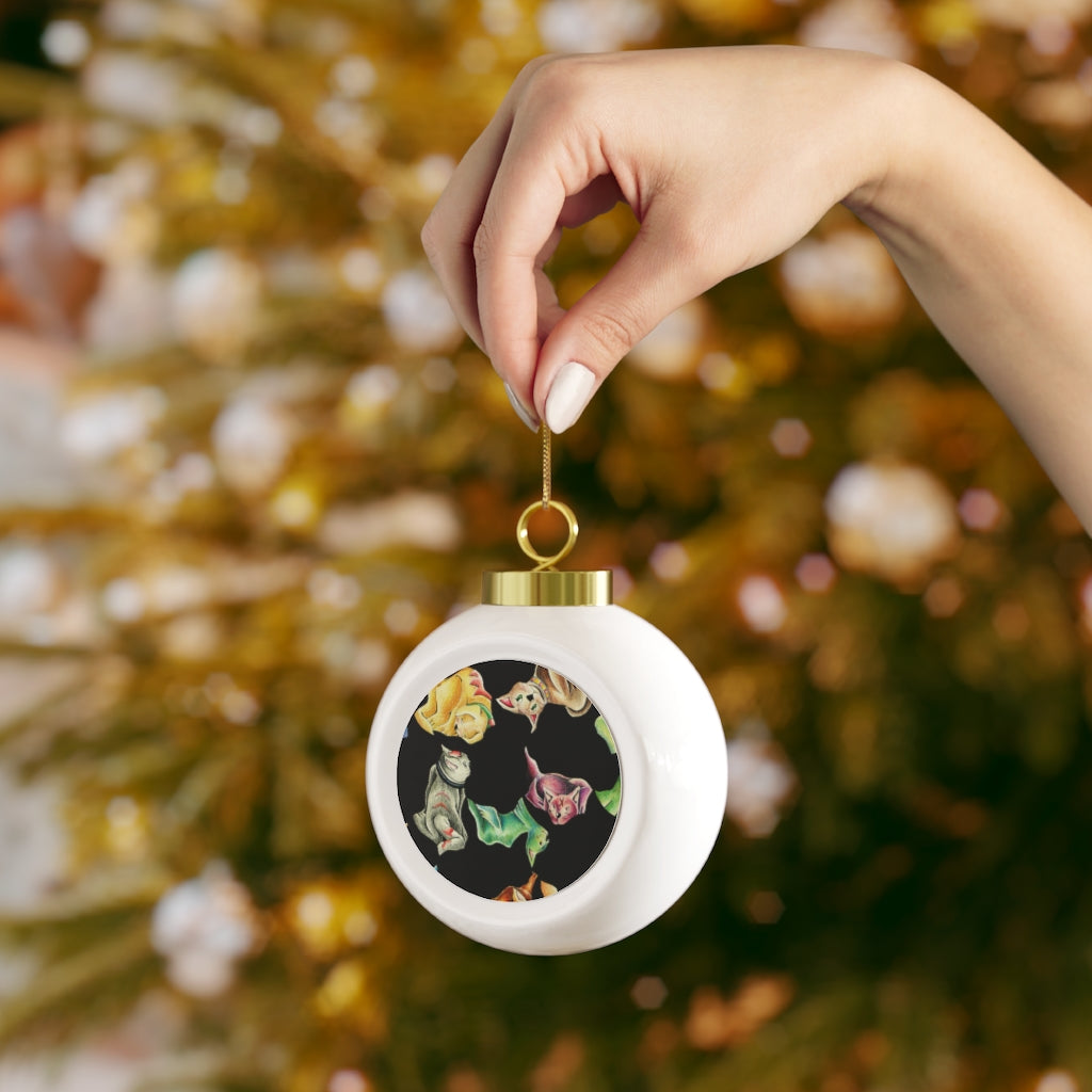 A 3-inch glossy Christmas ball ornament featuring a vintage cat pattern, adorned with a gold ribbon for hanging.