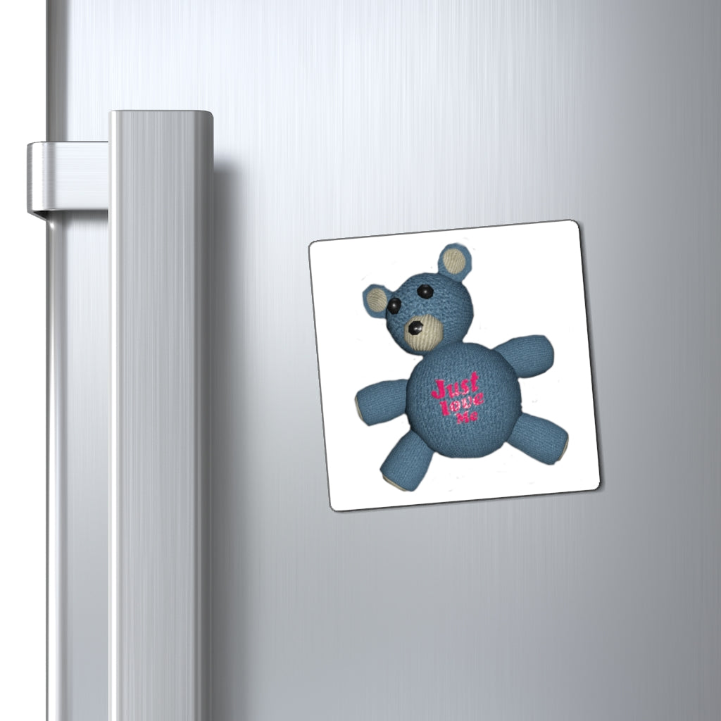 CG Bear Magnets displayed on a metallic surface, showcasing their strong hold and stylish black backing.