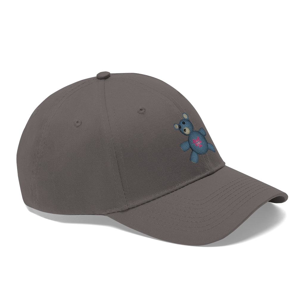 CG Bear Unisex Twill Hat in cotton twill fabric, featuring a classic 6-panel design and adjustable Velcro closure, perfect for outdoor activities.