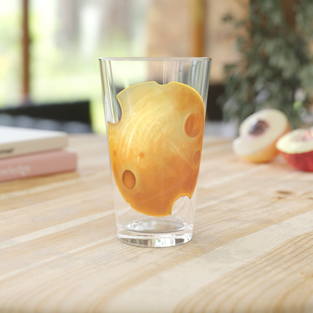 A clear 16oz Cheese Pint Glass showcasing a custom printed design, perfect for beverages.