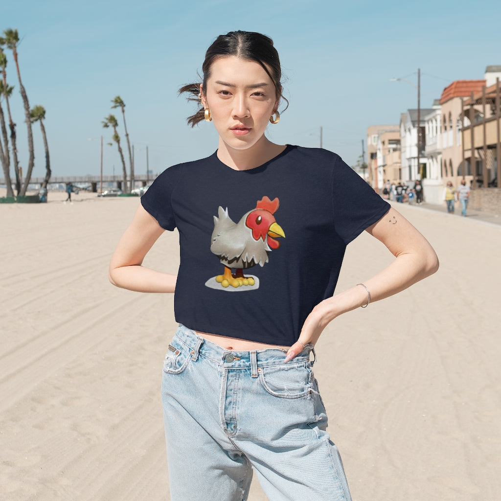 A stylish Chicken Women's Flowy Cropped Tee in a vibrant color, showcasing its flowy fit and modest crop design.