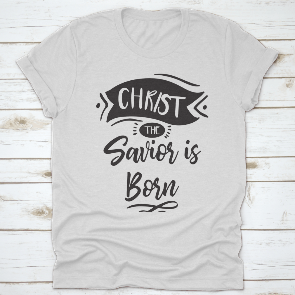 A festive Christmas print design featuring the phrase 'Christ The Savior Is Born' on a soft cotton fabric, perfect for holiday celebrations.