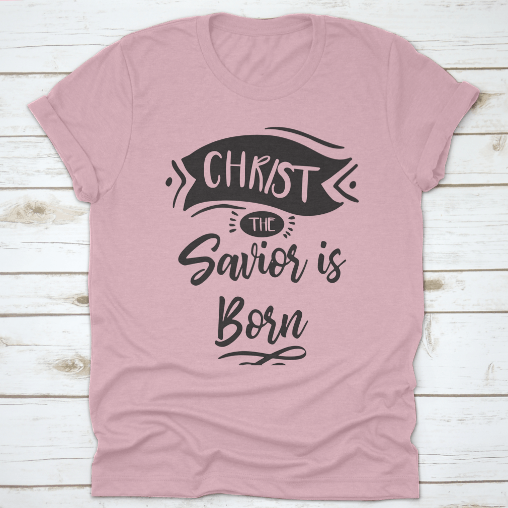 A festive Christmas print design featuring the phrase 'Christ The Savior Is Born' on a soft cotton fabric, perfect for holiday celebrations.