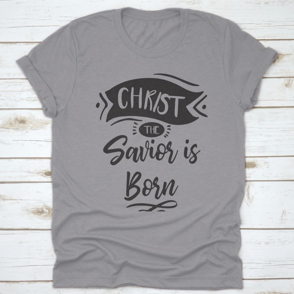 A festive Christmas print design featuring the phrase 'Christ The Savior Is Born' on a soft cotton fabric, perfect for holiday celebrations.