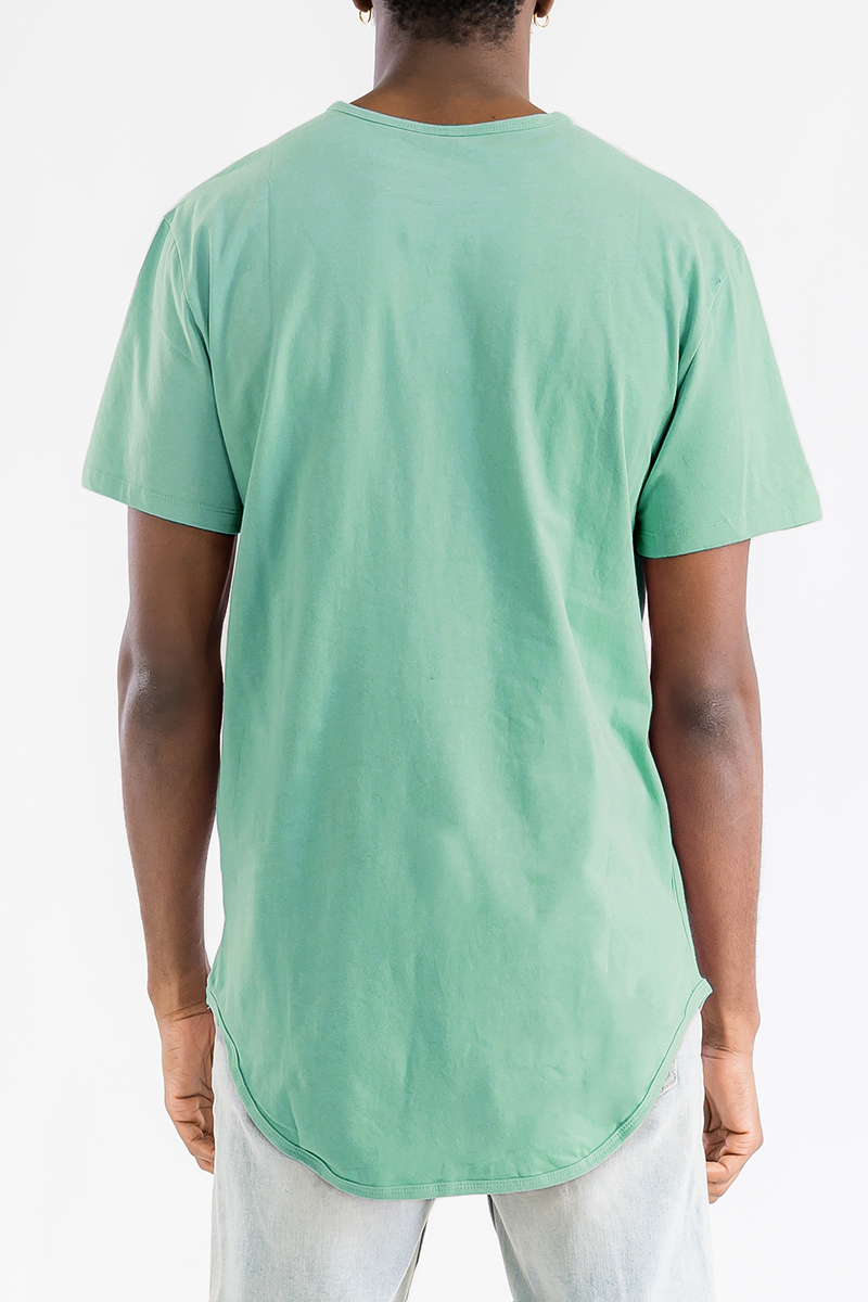 A stylish Classic Rounded Scallop Tee in a soft cotton fabric, featuring a scallop extended rounded edge design, displayed on a mannequin.