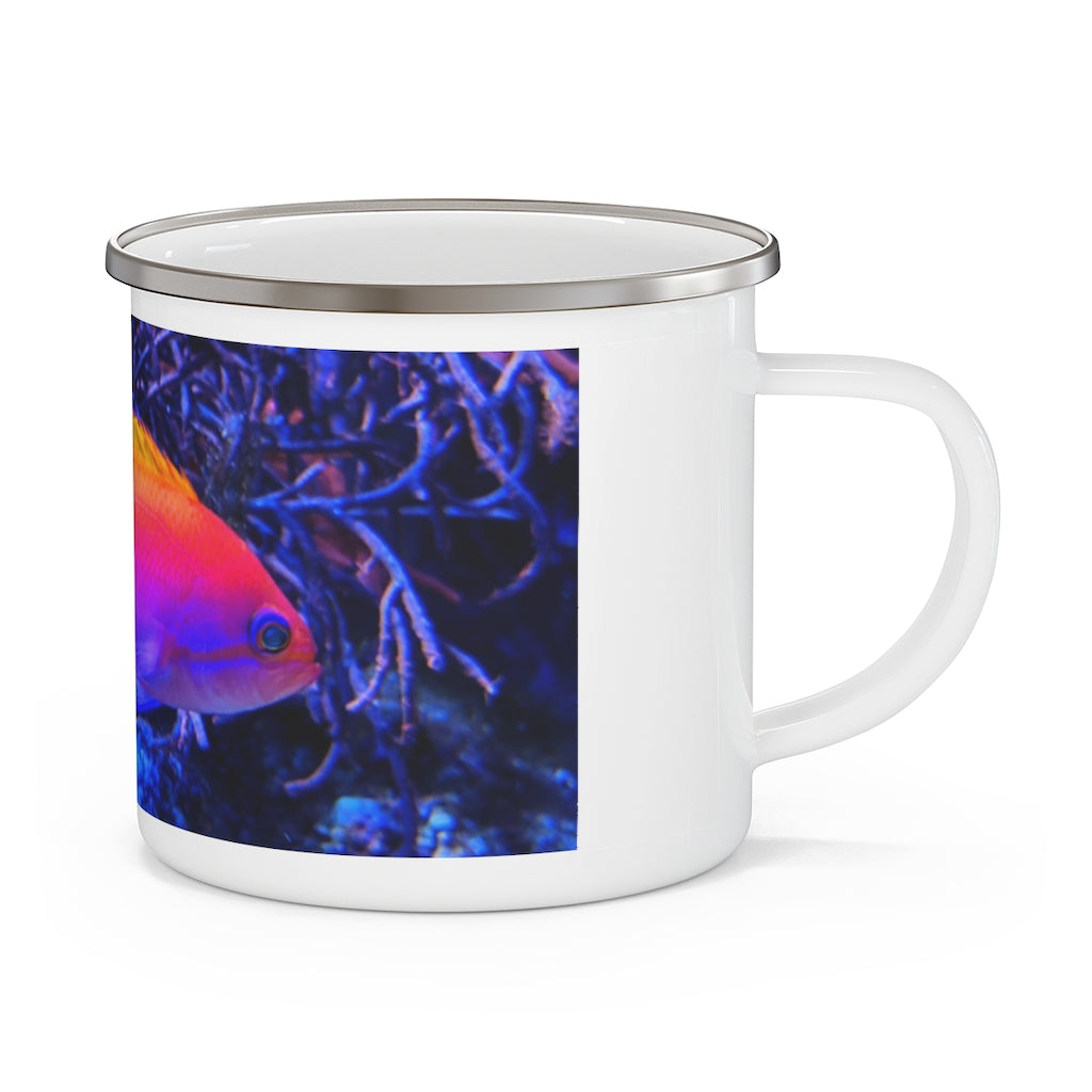 A colorful enamel camping mug featuring a fish design, perfect for outdoor use, showcasing its sturdy stainless steel construction and C-handle.