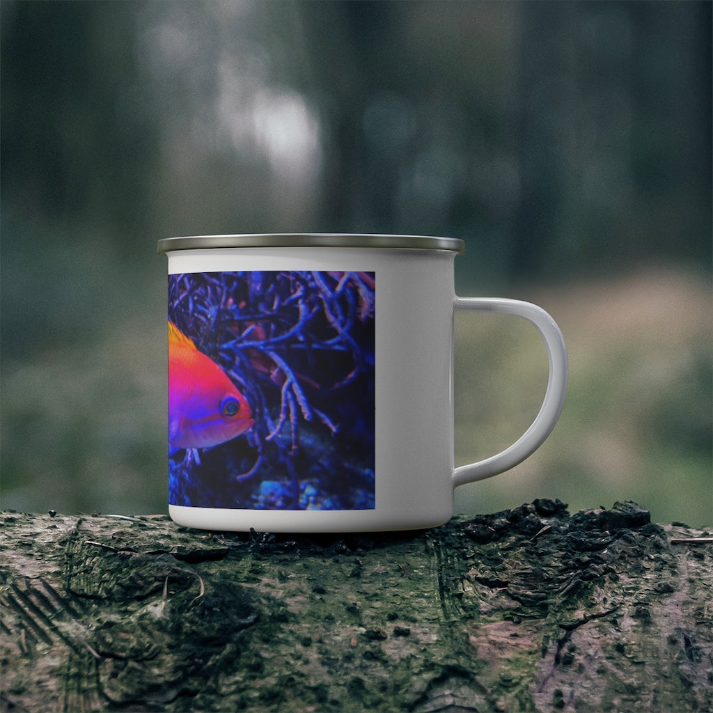 A colorful enamel camping mug featuring a fish design, perfect for outdoor use, showcasing its sturdy stainless steel construction and C-handle.