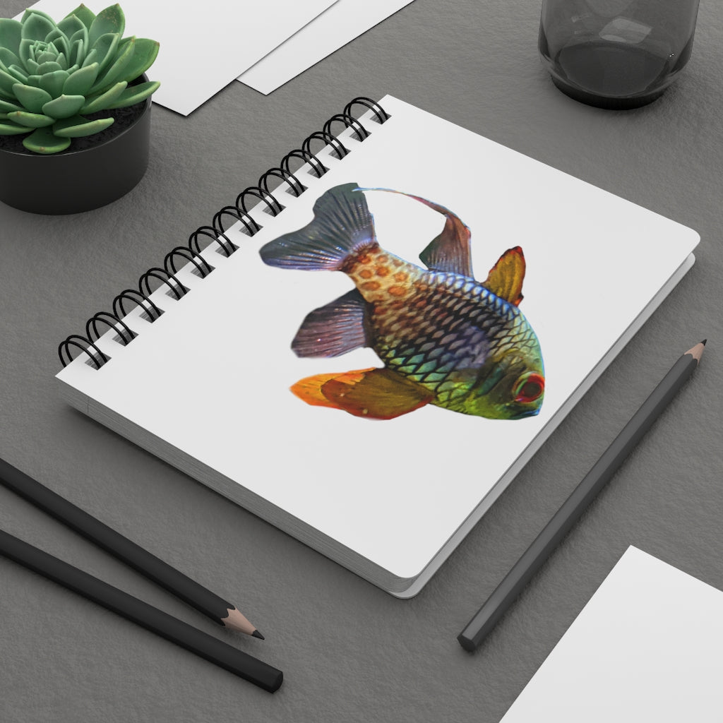 A colorful spiral bound journal featuring a vibrant fish design on a glossy laminated cover, showcasing its durable and stylish appearance.