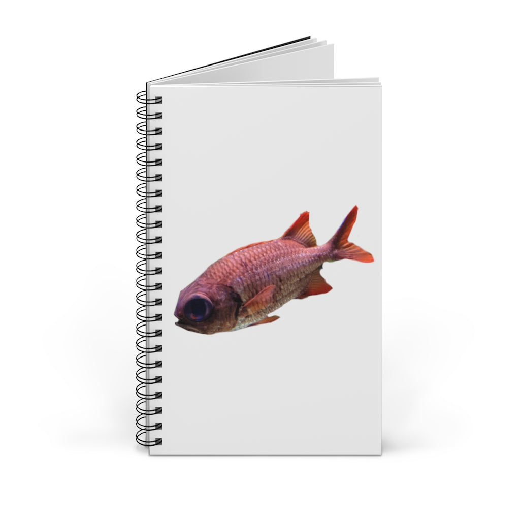 A colorful spiral journal featuring a vibrant fish design on the cover, showcasing various styles including blank, dot grid, lined, and task layouts.