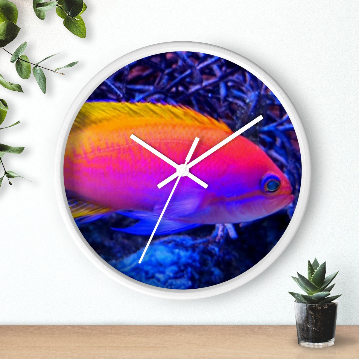 A colorful wall clock featuring vibrant fish designs in a wooden frame, perfect for indoor decor.