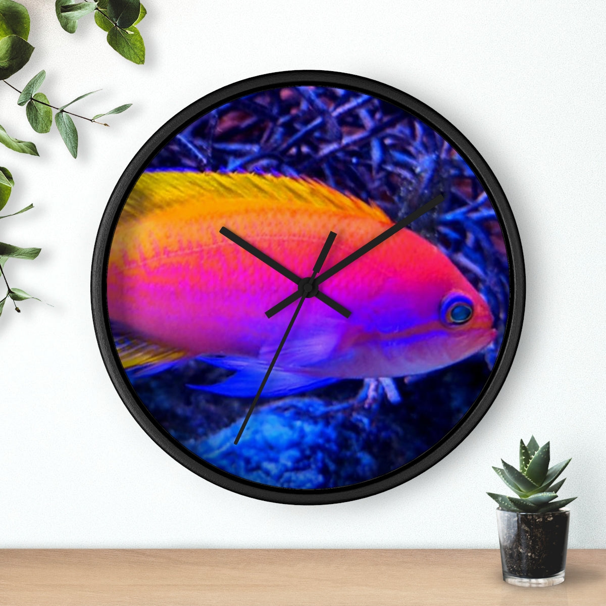 A colorful wall clock featuring vibrant fish designs in a wooden frame, perfect for indoor decor.