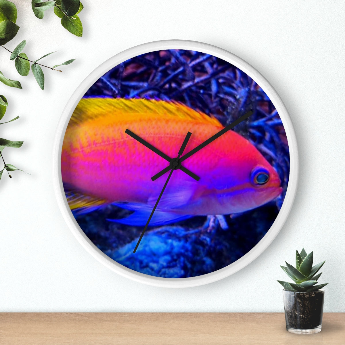 A colorful wall clock featuring vibrant fish designs in a wooden frame, perfect for indoor decor.