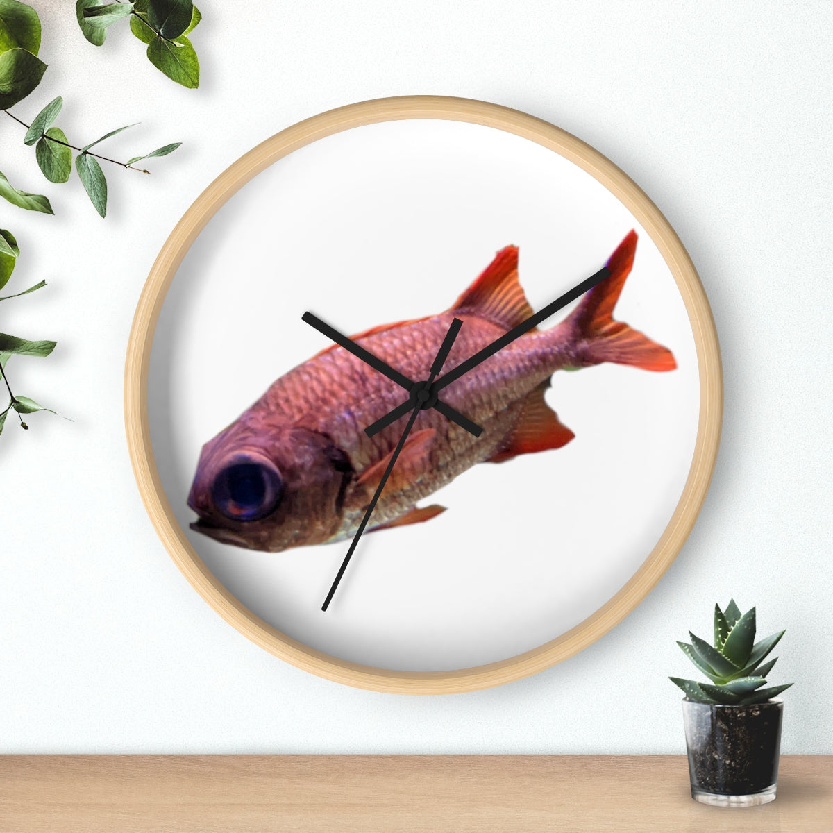 A colorful wall clock featuring a vibrant fish design, set in a wooden frame with a clear plexiglass face.