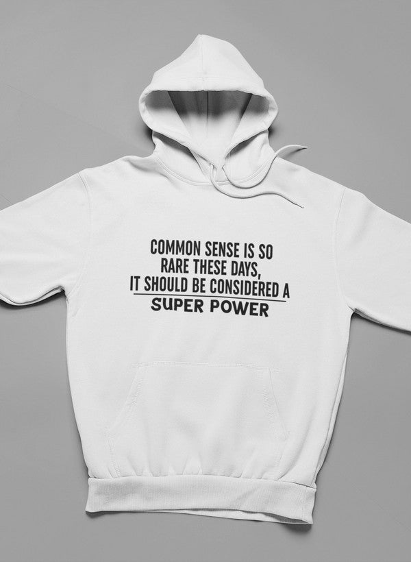 A stylish hoodie featuring the phrase 'Common Sense Should Be Considered A Superpower', designed by top artists, showcasing a cozy fleece material.