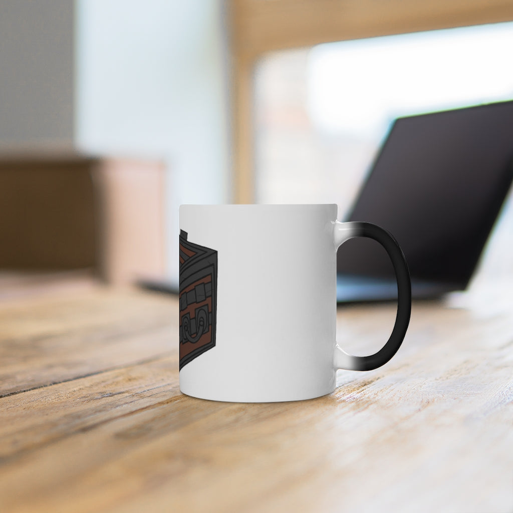 A white ceramic Crate Color Changing Mug displaying vibrant colors when filled with a hot beverage, showcasing its unique design.