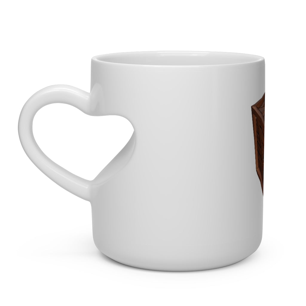 A charming white ceramic mug shaped like a heart with a heart-shaped handle, perfect for hot beverages.