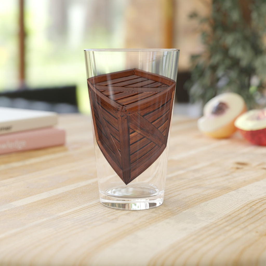 A clear 16oz Crate Pint Glass showcasing its elegant design, perfect for personalized printing.