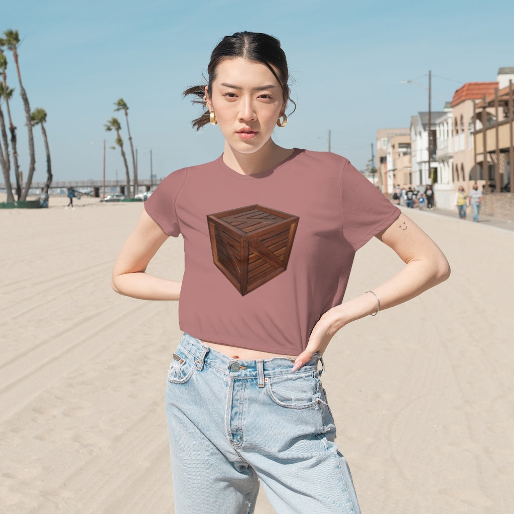 A stylish Crate Women's Flowy Cropped Tee in a light fabric, showcasing its flowy fit and modest crop design.